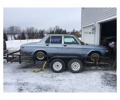 3105980